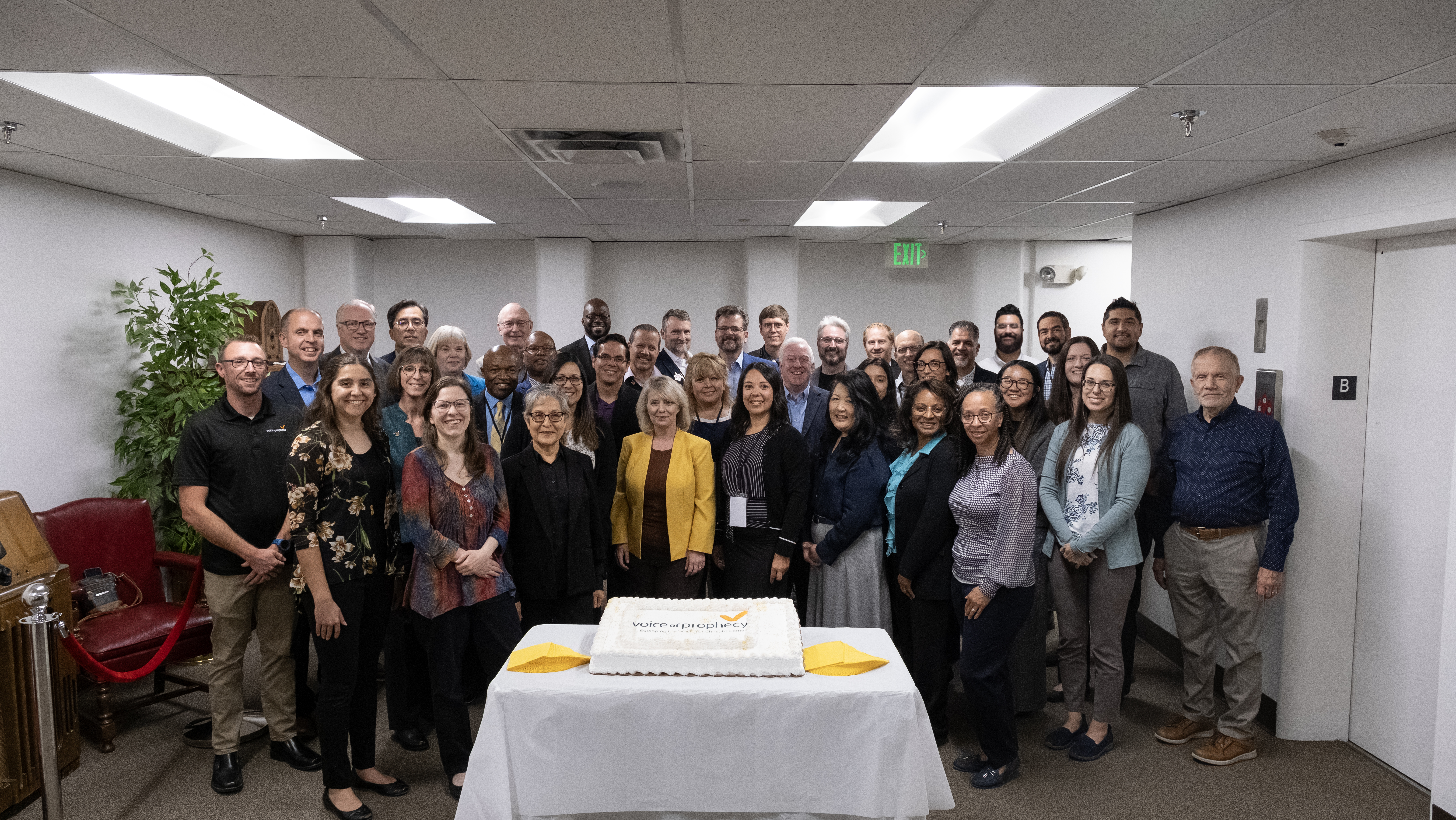 The Voice of Prophecy team gathers with their executive committee to celebrate the ministry’s upcoming 95th birthday with a delicious cake.